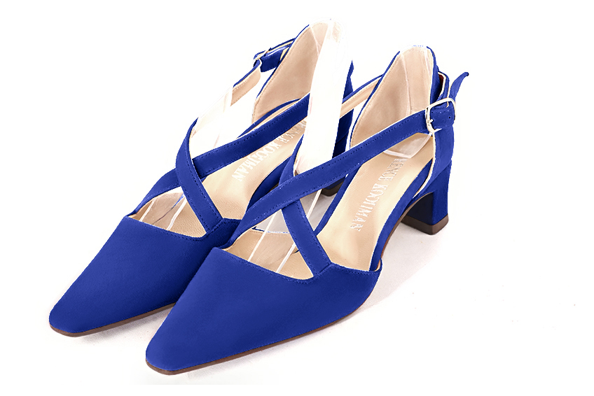 Electric blue women's open side shoes, with crossed straps. Tapered toe. Low kitten heels. Front view - Florence KOOIJMAN